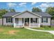Charming single-story home with a cozy front porch and well-maintained landscaping at 810 4Th St, Kings Mountain, NC 28086