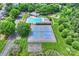Scenic aerial view of community amenities: pool, clubhouse, tennis courts, playground, and parking areas at 8417 Hirsch Dr, Charlotte, NC 28277