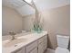 Bright bathroom featuring a white vanity, neutral walls, and decorative accents at 8417 Hirsch Dr, Charlotte, NC 28277