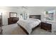 Cozy bedroom with natural light, a neutral color palette, and ample closet space at 8417 Hirsch Dr, Charlotte, NC 28277
