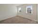 Bedroom featuring neutral walls, carpeting, and bright windows that provide ample natural light at 8417 Hirsch Dr, Charlotte, NC 28277