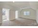 Spacious bonus room with neutral walls, carpeting, and natural light from windows at 8417 Hirsch Dr, Charlotte, NC 28277