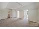 Open bonus room with neutral paint, carpet, and plenty of space for activities at 8417 Hirsch Dr, Charlotte, NC 28277