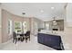 Bright breakfast nook area with a view of the modern kitchen and living room at 8417 Hirsch Dr, Charlotte, NC 28277