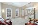Bright living room featuring large windows, comfortable seating, and an open layout at 8417 Hirsch Dr, Charlotte, NC 28277