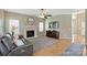Comfortable living room with fireplace, mounted television, and hardwood floors at 8417 Hirsch Dr, Charlotte, NC 28277