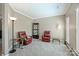 Cozy living room featuring plush leather recliners, neutral walls, and crown molding at 8417 Hirsch Dr, Charlotte, NC 28277