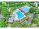 Aerial view of a community pool, tennis courts, and surrounding landscaping at 8417 Hirsch Dr, Charlotte, NC 28277