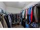 Walk-in closet with organized hanging storage and shelving at 8417 Hirsch Dr, Charlotte, NC 28277