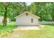 Rear view of the home showing the siding, window, and part of the backyard at 909 Lakeview St, Kannapolis, NC 28083