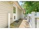 Charming back porch with white railings leading to the home's side door at 909 Lakeview St, Kannapolis, NC 28083