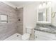 Modern bathroom with a tiled shower, granite vanity, and updated fixtures for a spa-like experience at 909 Lakeview St, Kannapolis, NC 28083