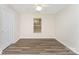 Minimalist bedroom with clean lines, features a window offering natural light at 909 Lakeview St, Kannapolis, NC 28083