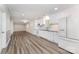 Open kitchen featuring white cabinets, granite countertops, and stainless-steel appliances at 909 Lakeview St, Kannapolis, NC 28083