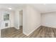 Well-lit mud room with shiplap accent wall and wood-look flooring, offering practicality and style at 909 Lakeview St, Kannapolis, NC 28083