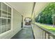 Inviting covered porch with swing and railing detail, perfect for relaxing outdoors at 909 Lakeview St, Kannapolis, NC 28083