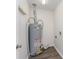 View of hot water heater installed with vent and hoses and connections at 909 Lakeview St, Kannapolis, NC 28083