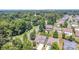 Residential neighborhood featuring well-maintained houses surrounded by lush greenery and mature trees at 101 Daybreak Ln, Belmont, NC 28012