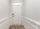 A bright entryway with clean white walls and stylish wood-look floors welcomes you at 101 Daybreak Ln, Belmont, NC 28012