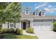 Charming home featuring a two-car garage and beautifully landscaped front yard at 101 Daybreak Ln, Belmont, NC 28012