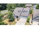 Charming two-story home features a well-maintained yard, attached two-car garage, and dormer windows at 101 Daybreak Ln, Belmont, NC 28012