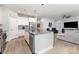 Open kitchen features granite countertops, stainless steel appliances and seamless flow to the living room at 101 Daybreak Ln, Belmont, NC 28012
