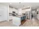 Bright kitchen with an island featuring granite countertops, stainless steel appliances, and ample seating at 101 Daybreak Ln, Belmont, NC 28012