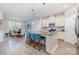 Modern kitchen with granite island, breakfast bar, stainless appliances, and a connected dining area at 101 Daybreak Ln, Belmont, NC 28012