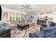 Open-concept living room flowing into the kitchen, featuring comfortable seating and modern finishes at 101 Daybreak Ln, Belmont, NC 28012