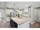 Modern kitchen with stainless steel appliances, granite countertops, and a center island with seating at 10437 Paper Birch Dr, Charlotte, NC 28215