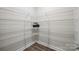 Walk-in pantry featuring wire shelving for organized storage of food and kitchen essentials at 10437 Paper Birch Dr, Charlotte, NC 28215