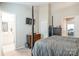 Spacious bedroom leading to the bathroom, with neutral walls and a four-poster bed at 11521 Savannah Creek Dr, Charlotte, NC 28273