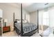 Bright bedroom featuring a four-poster bed, with natural light streaming through the large windows at 11521 Savannah Creek Dr, Charlotte, NC 28273