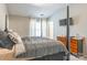 Bedroom featuring a four-poster bed, neutral tones, and a television mounted on the wall at 11521 Savannah Creek Dr, Charlotte, NC 28273