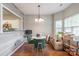 Inviting dining area with hardwood floors, modern decor, and natural light from nearby windows at 11521 Savannah Creek Dr, Charlotte, NC 28273