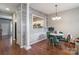 Dining area with hardwood floors, unique wall accents, and a view into the kitchen at 11521 Savannah Creek Dr, Charlotte, NC 28273