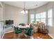 Comfortable dining area featuring hardwood floors, warm lighting, and a cozy atmosphere at 11521 Savannah Creek Dr, Charlotte, NC 28273