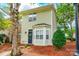A charming home features a cozy bay window, a decorative wreath, and mature trees surrounding it at 11521 Savannah Creek Dr, Charlotte, NC 28273