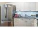Efficient kitchen space with modern stainless steel appliances, sleek cabinets, and ample storage at 11521 Savannah Creek Dr, Charlotte, NC 28273