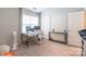 Well-lit home office featuring a modern desk setup, comfortable seating, and ample workspace at 11521 Savannah Creek Dr, Charlotte, NC 28273