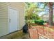 Outdoor patio area featuring a convenient storage area and pleasant natural surroundings at 11521 Savannah Creek Dr, Charlotte, NC 28273