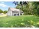 Expansive backyard with lush green grass, outdoor seating and shaded by mature trees at 117 Franklin St, Clover, SC 29710