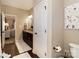 Bathroom with a double vanity and granite counters leading to the Primary bedroom at 117 Franklin St, Clover, SC 29710