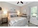 Bright bedroom with a ceiling fan, a large window, and neutral decor at 117 Franklin St, Clover, SC 29710