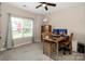 Bright bedroom features a ceiling fan, natural light, and a cozy workstation at 117 Franklin St, Clover, SC 29710