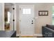Bright entryway featuring white door, stylish decor, and a glimpse into the living area at 117 Franklin St, Clover, SC 29710
