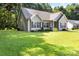 A charming single-story home with a well-maintained lawn, showcasing its curb appeal and setting at 117 Franklin St, Clover, SC 29710