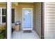 Welcoming front door with blue paint, decorative flower pot and 'Welcome' door mat at 117 Franklin St, Clover, SC 29710