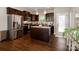 Modern kitchen with stainless steel appliances, granite counters, and center island with pendant lighting at 117 Franklin St, Clover, SC 29710