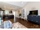 Open-concept living space with hardwood floors, modern decor, and seamless flow to the kitchen at 117 Franklin St, Clover, SC 29710